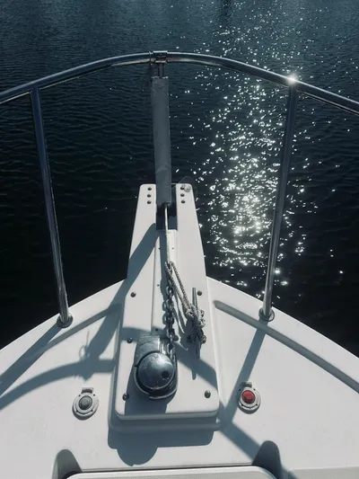 Someday Yacht Photos Pics Bow of 2012 Back Cove 34 boat with anchor and sparkling water.