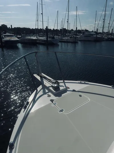 Someday Yacht Photos Pics 2012 Back Cove 34 yacht docked in a marina with sailboats.