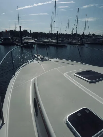 Someday Yacht Photos Pics 2012 Back Cove 34 boat docked in a marina with sailboats.