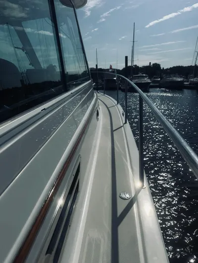 Someday Yacht Photos Pics 2012 Back Cove 34 yacht, side view on water, sunny day.