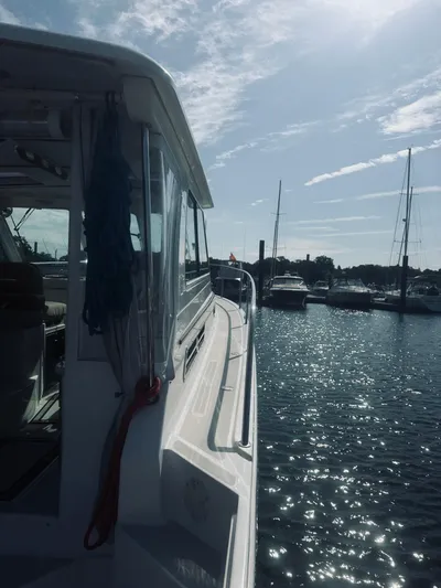 Someday Yacht Photos Pics 2012 Back Cove 34 boat docked in sunny marina with sailboats.