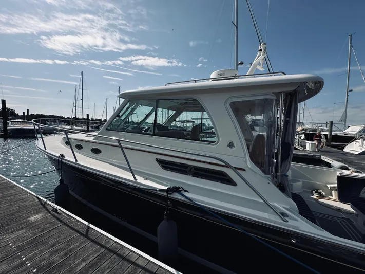 Someday Yacht Photos Pics 2012 Back Cove 34 yacht docked at marina under clear blue sky.