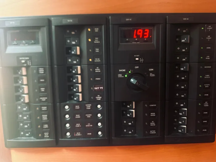 Someday Yacht Photos Pics Electrical control panel on 2012 Back Cove 34 boat, featuring switches and digital display.