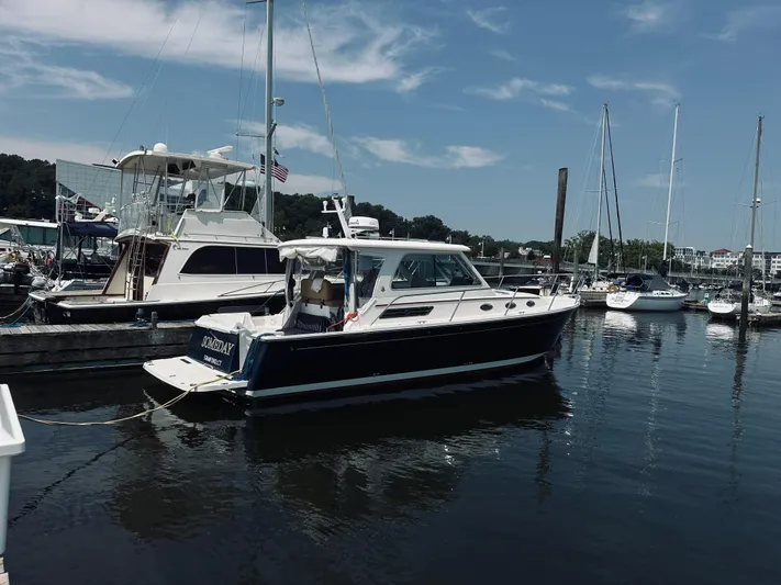 Someday Yacht Photos Pics 2012 Back Cove 34 boat docked in a marina under a clear blue sky.