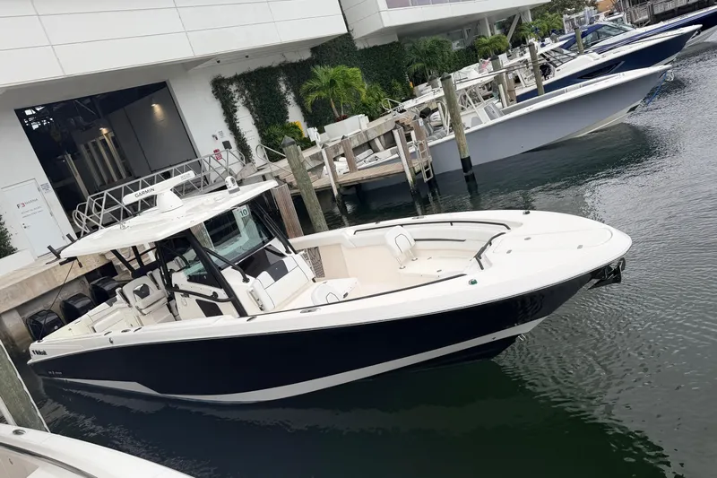  Yacht Photos Pics 2019 Wellcraft 352 Fisherman boat docked at a marina, sleek design and modern features.