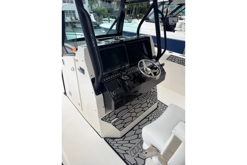  Yacht Photos Pics 2019 Wellcraft 352 Fisherman boat helm with modern controls and steering wheel.