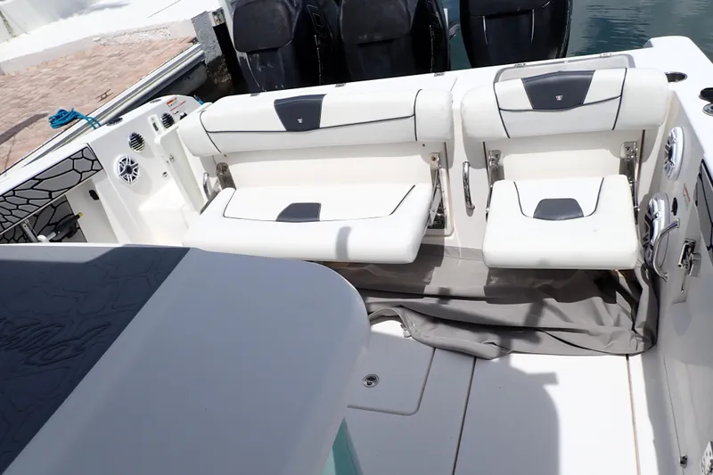  Yacht Photos Pics 2019 Wellcraft 352 Fisherman boat interior with white seating and modern design.