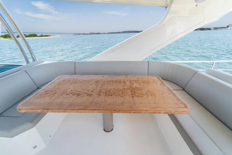  Yacht Photos Pics Luxurious seating area on 2023 Absolute 62 Fly yacht with ocean view.