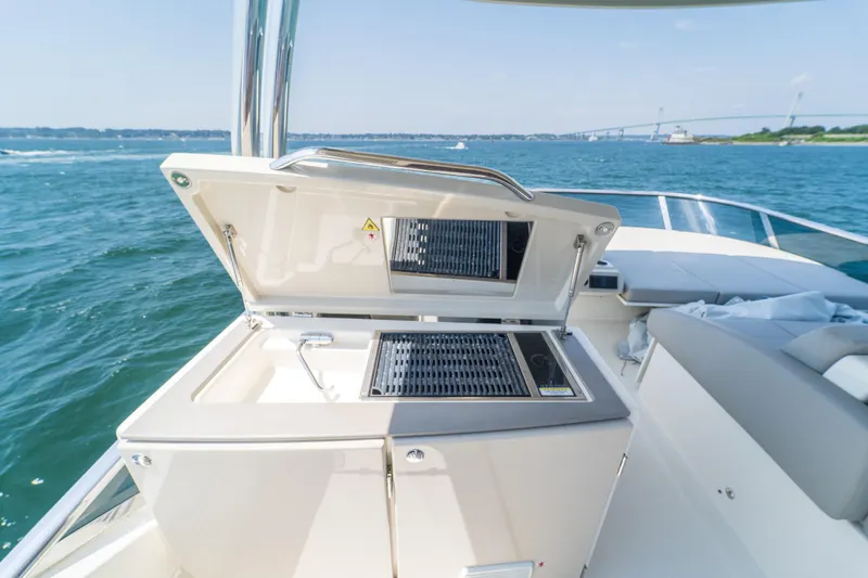  Yacht Photos Pics Luxury outdoor kitchen on 2023 Absolute 62 Fly yacht, with ocean view.