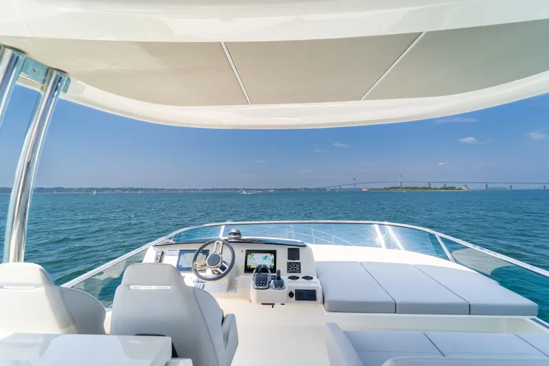  Yacht Photos Pics 2023 Absolute 62 Fly yacht helm with ocean view and bridge in the distance.
