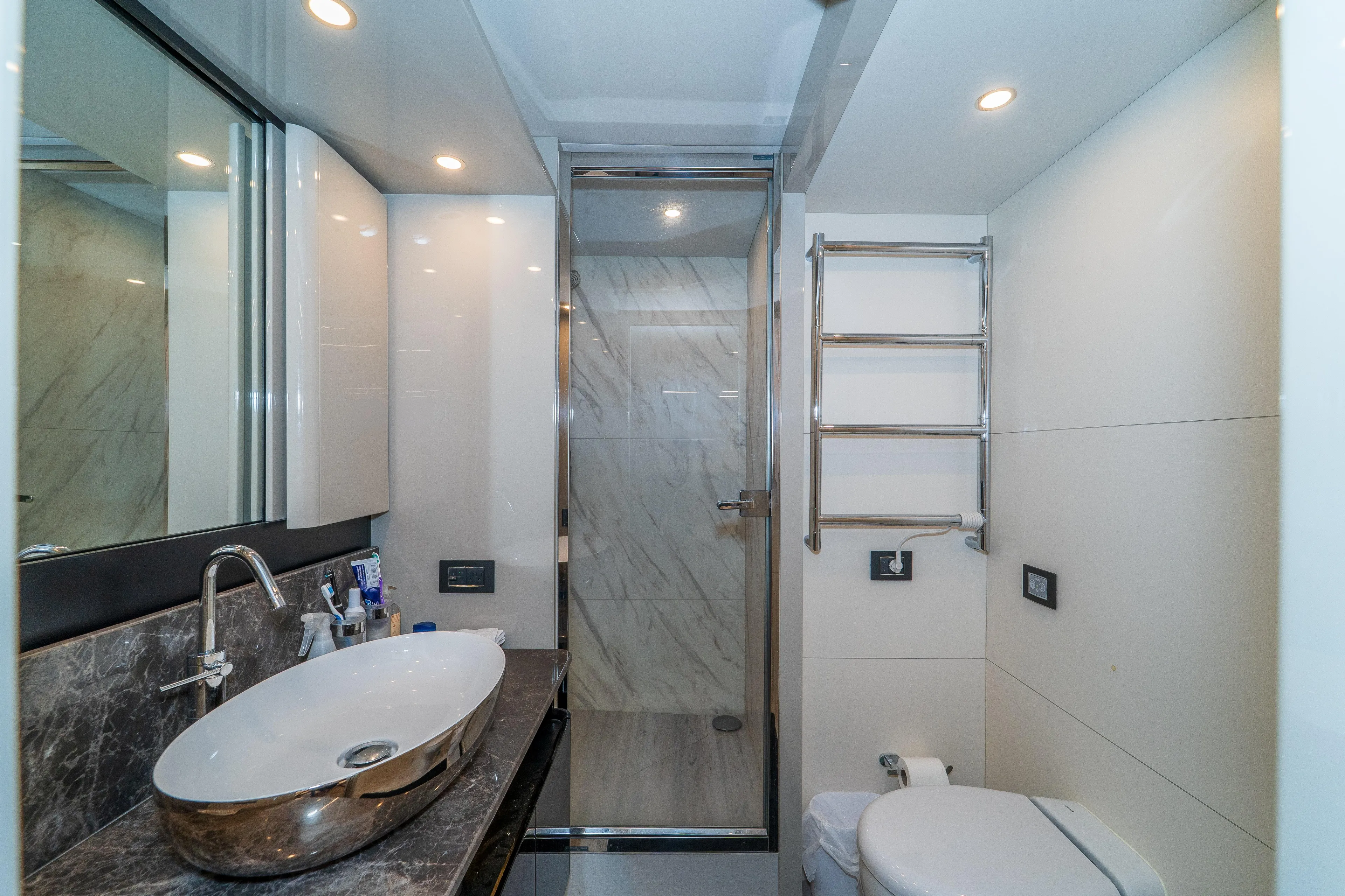  Yacht Photos Pics Luxurious bathroom on 2023 Absolute 62 Fly yacht with modern fixtures and elegant design.