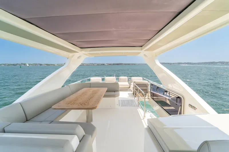  Yacht Photos Pics Luxurious 2023 Absolute 62 Fly yacht with spacious deck and ocean view.