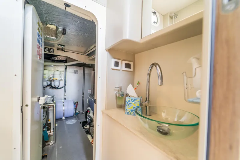  Yacht Photos Pics Modern bathroom and engine room on 2023 Absolute 62 Fly yacht.