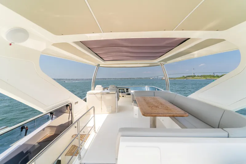  Yacht Photos Pics Luxurious 2023 Absolute 62 Fly yacht interior with spacious seating and ocean view.