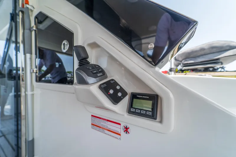 Yacht Photos Pics Control panel of 2023 Absolute 62 Fly yacht with joystick and display.