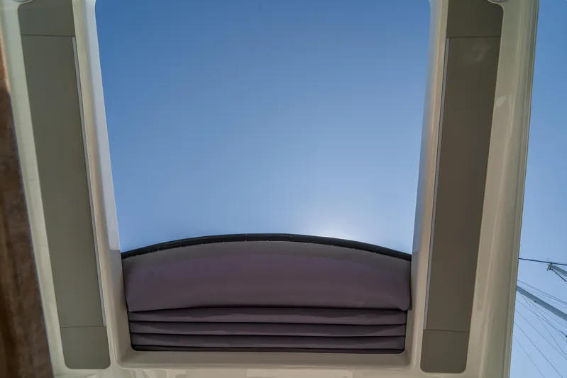  Yacht Photos Pics Sunroof view from 2023 Absolute 62 Fly yacht, showcasing clear blue sky.