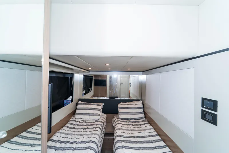  Yacht Photos Pics Interior of 2023 Absolute 62 Fly yacht with twin beds and modern design.