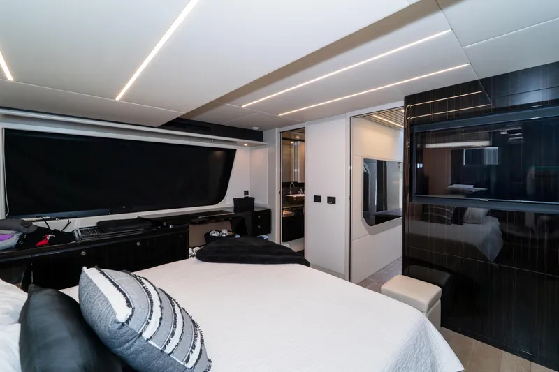  Yacht Photos Pics Luxurious interior of 2023 Absolute 62 Fly yacht with modern bedroom design.