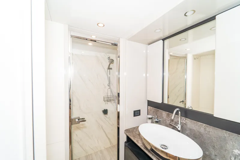  Yacht Photos Pics Luxurious bathroom on 2023 Absolute 62 Fly yacht with modern fixtures and elegant design.