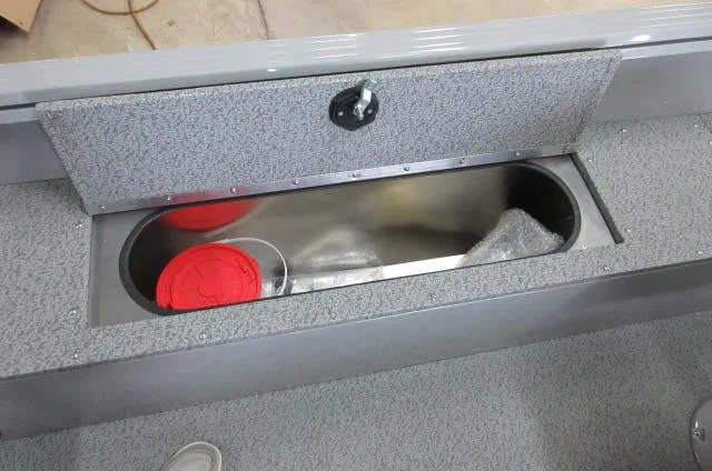 2023 Smoker Craft Freedom 160 TL boat storage compartment with red containers.