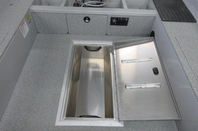 2023 Smoker Craft Freedom 160 TL boat interior with open storage compartment.