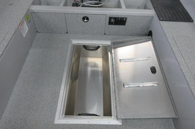 2023 Smoker Craft Freedom 160 TL boat interior with open storage compartment.