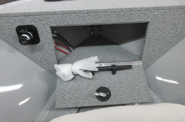 2023 Smoker Craft Freedom 160 TL boat interior storage compartment.