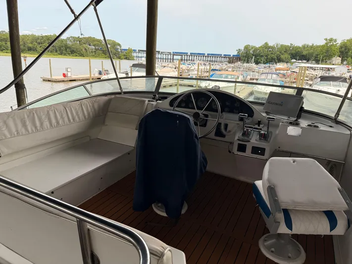  Yacht Photos Pics 2000 Bayliner 4087 Aft Cabin Motoryacht helm with marina view in background.