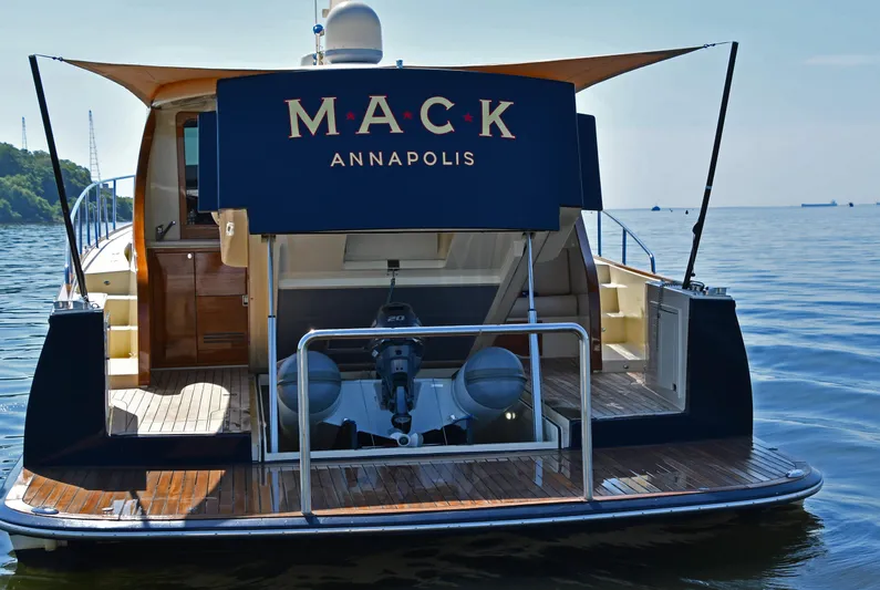 Mack Yacht Photos Pics 2020 Palm Beach Motor Yachts PB52 on calm water, rear view with canopy.