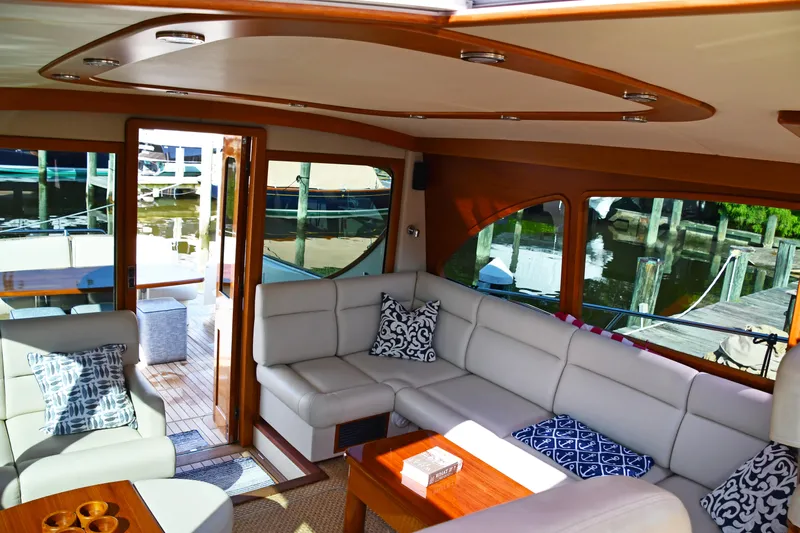 Mack Yacht Photos Pics Luxurious interior of 2020 Palm Beach Motor Yachts PB52 with elegant seating and waterfront view.