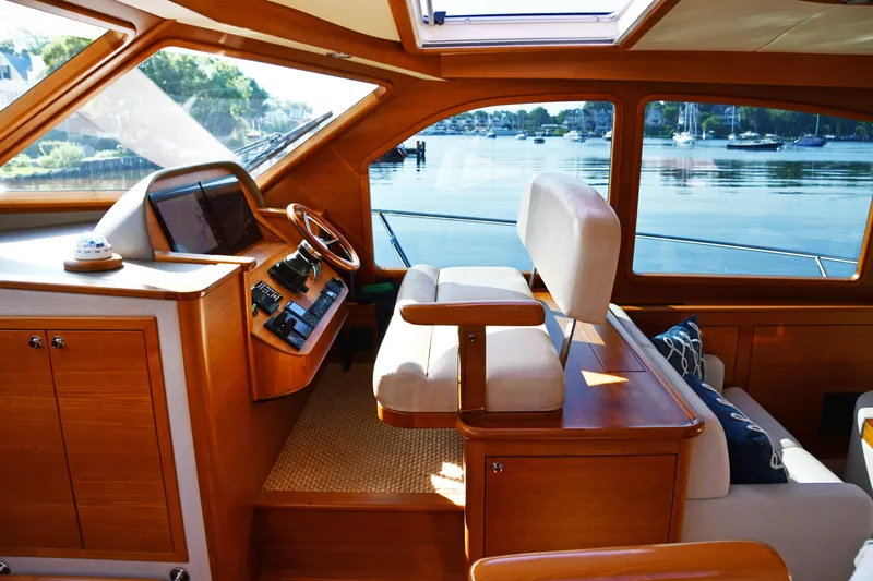 Mack Yacht Photos Pics Luxurious 2020 Palm Beach Motor Yachts PB52 interior with elegant wood finish and waterfront view.