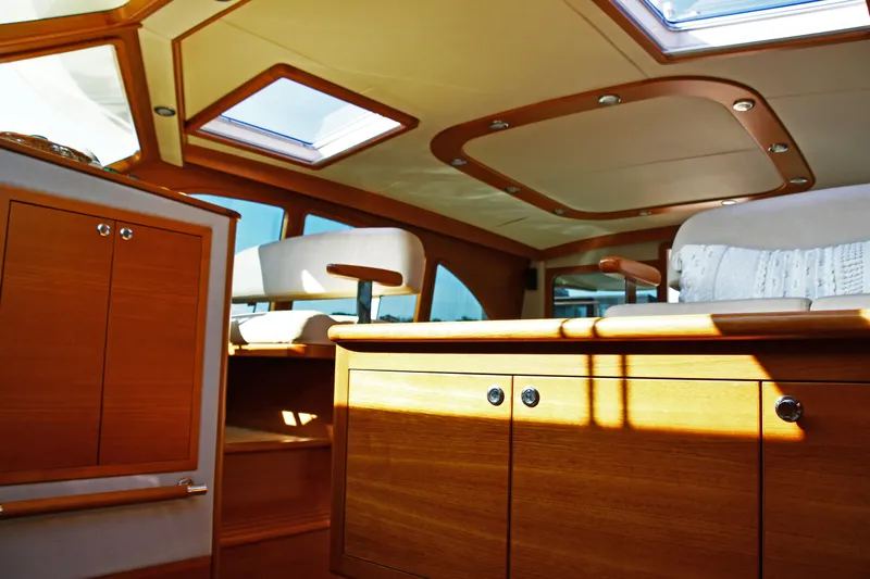 Mack Yacht Photos Pics Luxurious interior of 2020 Palm Beach Motor Yachts PB52, featuring elegant wood finishes.