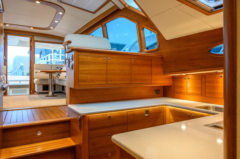 Mack Yacht Photos Pics Luxurious interior of 2020 Palm Beach Motor Yachts PB52 with elegant wood finishes and modern design.