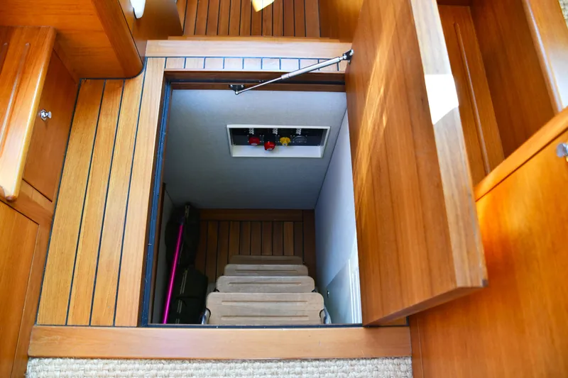 Mack Yacht Photos Pics 2020 Palm Beach Motor Yachts PB52 interior with wooden hatch and stairs.