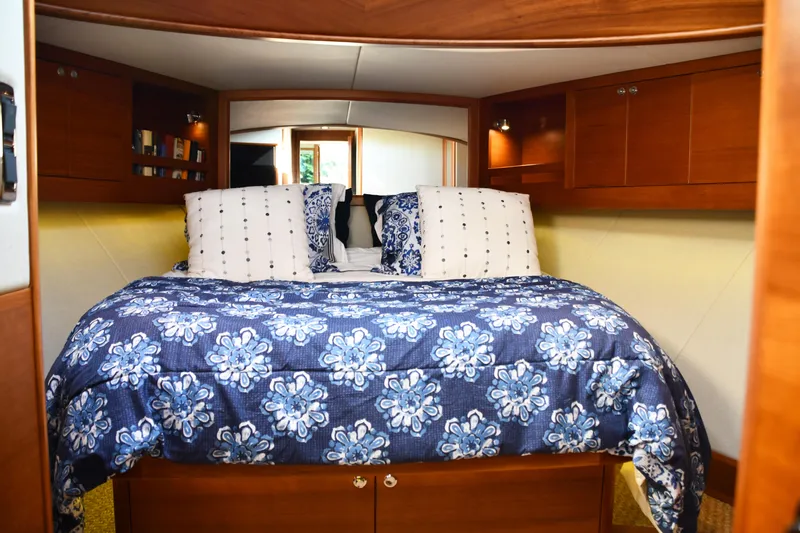 Mack Yacht Photos Pics Luxurious cabin interior of 2020 Palm Beach Motor Yachts PB52 with floral bedding.