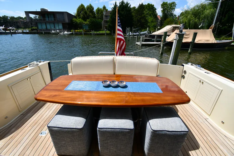 Mack Yacht Photos Pics Luxury 2020 Palm Beach Motor Yachts PB52 deck with elegant dining setup.