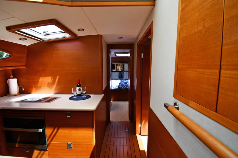 Mack Yacht Photos Pics Luxurious interior of 2020 Palm Beach Motor Yachts PB52, featuring elegant wood finishes and modern amenities.