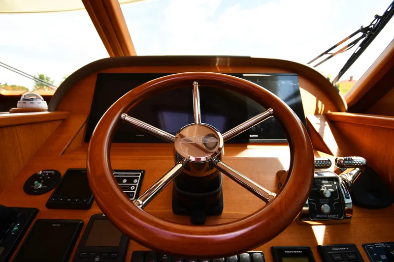 Mack Yacht Photos Pics Steering wheel of 2020 Palm Beach Motor Yachts PB52, featuring modern controls and navigation equipment.