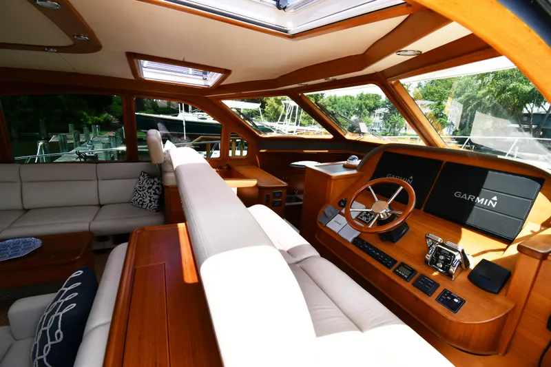Mack Yacht Photos Pics Luxurious interior of 2020 Palm Beach Motor Yachts PB52 with modern helm and seating.