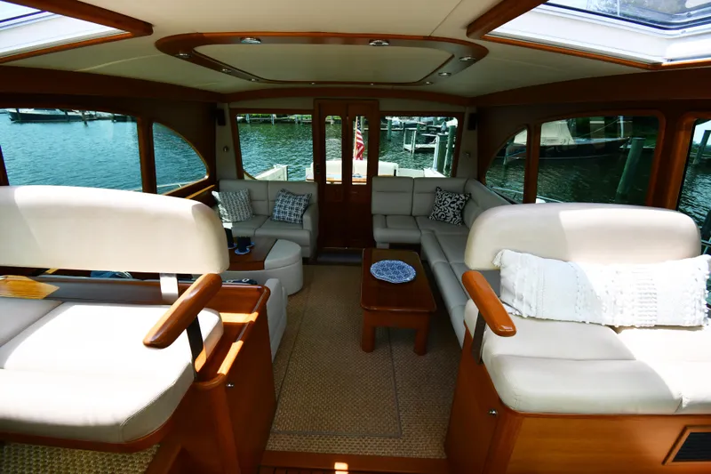 Mack Yacht Photos Pics Luxurious interior of 2020 Palm Beach Motor Yachts PB52 with elegant seating and waterfront view.