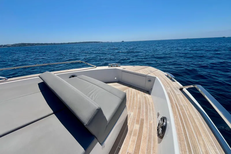 Blue Moon Yacht Photos Pics Luxury Fiart 43 yacht deck with sunbed, 2021 model, cruising on open sea.