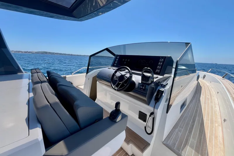 Blue Moon Yacht Photos Pics Luxury Fiart 43 yacht cockpit with modern controls, sleek design, and ocean view, 2021 model.