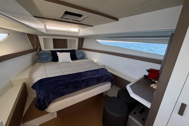 Blue Moon Yacht Photos Pics Luxurious cabin interior of 2021 Fiart 43 yacht with cozy bed and modern decor.