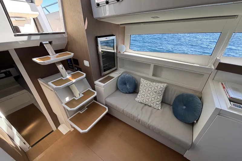 Blue Moon Yacht Photos Pics Interior of 2021 Fiart 43 yacht with modern seating and ocean view.