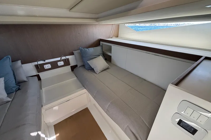 Blue Moon Yacht Photos Pics Interior cabin of 2021 Fiart 43 yacht with modern bedding and ocean view.