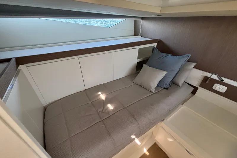 Blue Moon Yacht Photos Pics Luxurious cabin interior of 2021 Fiart 43 yacht with cozy bedding and modern design.