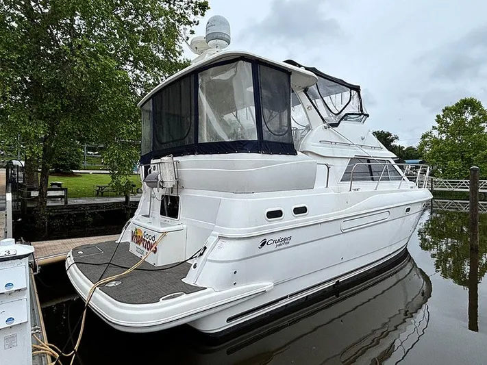  Yacht Photos Pics 2004 Cruisers Yachts 375 Motoryacht docked, featuring sleek design and spacious deck.