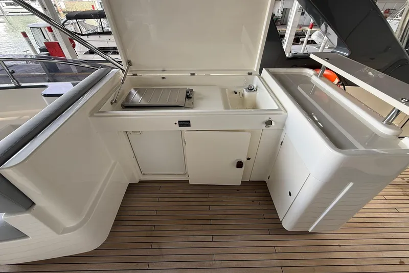 Evolution Yacht Photos Pics Outdoor kitchen on 2013 Ferretti Yachts 800, featuring sink and grill on teak deck.