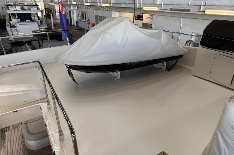 Evolution Yacht Photos Pics 2013 Ferretti Yachts 800 deck with covered equipment and seating area.