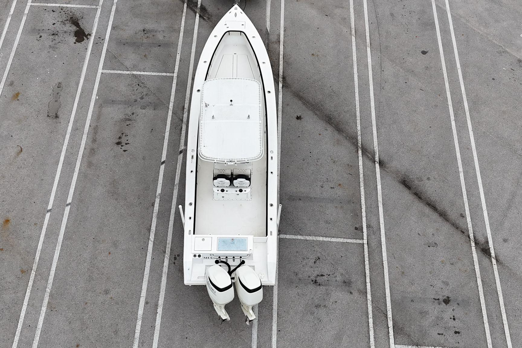 Aerial view of a 2002 Island Runner 31 boat parked on a concrete surface.